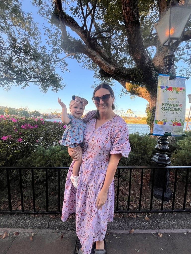 Mom and baby at Epcot Flower & Garden Festival in Disney World. 